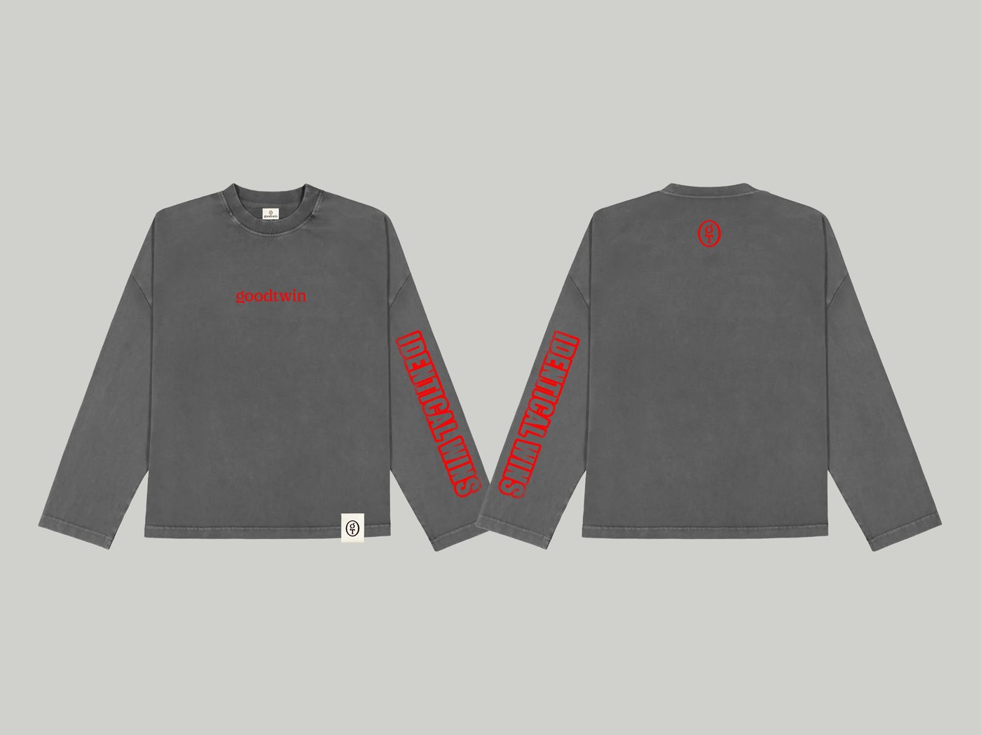 Washed grey long sleeve, front and back: red goodtwin wordmark on the chest, red Identical Wins print down the sleeves, monogram on the back